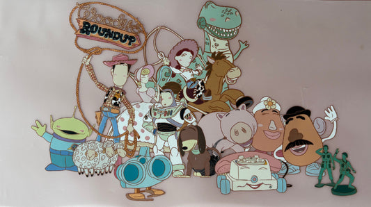 Colorful embroidered patch with cartoon characters on a pink background cowboy dinosaur 