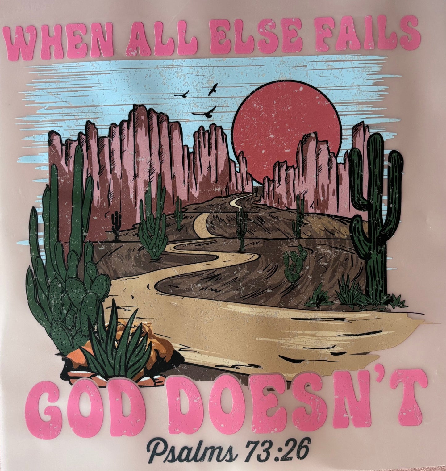 DTF transfer with a mountain and sunset design, text 'GOD DOESN'T' and 'WHEN ALL ELSE FAILS'