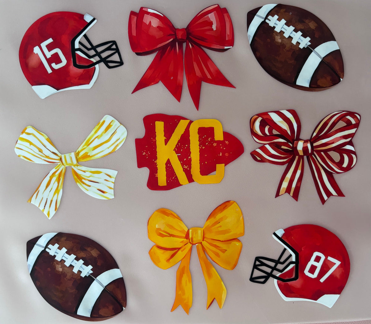 dtf transfer with footballs, bows, and helmets on a pink background KC kansas city sports football tshirt tote
