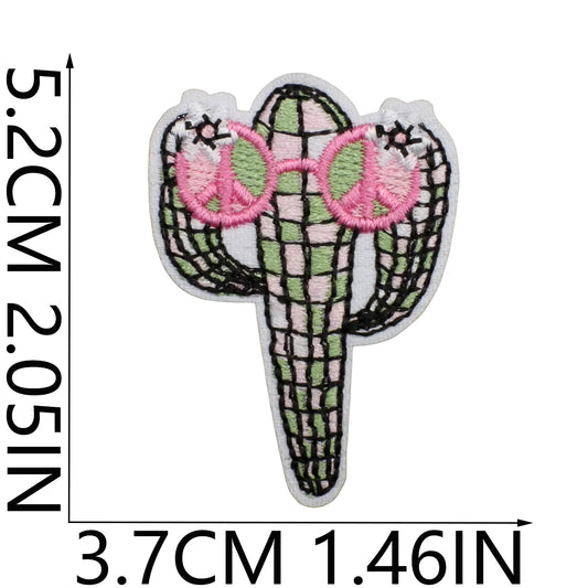 Embroidered patch of a cactus with peace signs, shown with measurements on a white background cowgirl western 