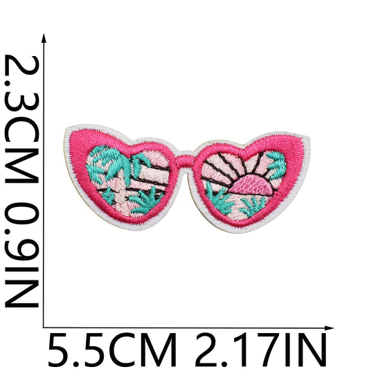 Embroidered patch of sunglasses with floral design, shown with measurements on a white background.